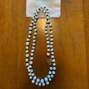 Beauty in Stone.  Long strand of pearls.